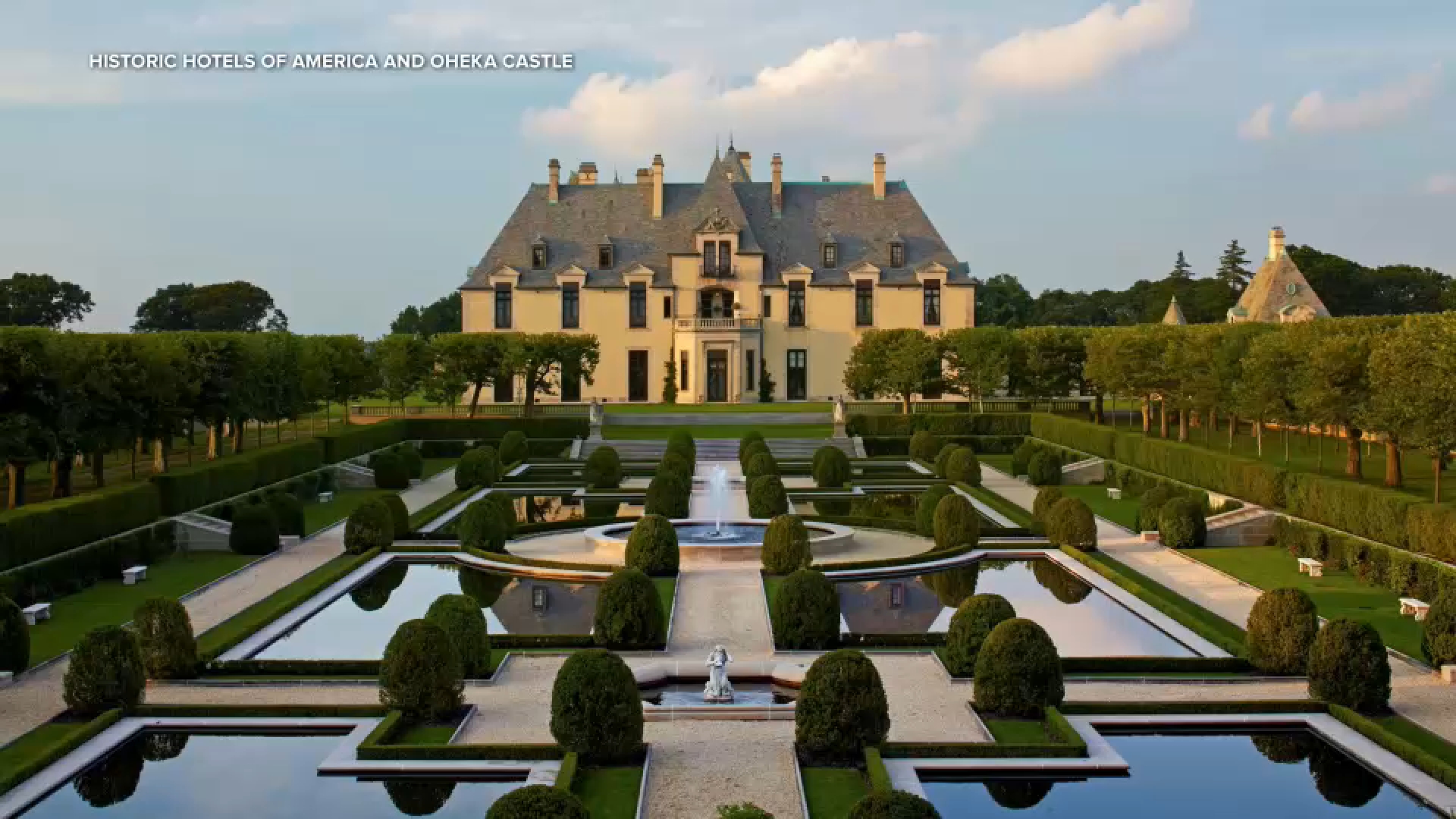 Oheka Castle on Long Island, a historic estate with turrets and grand architecture under a clear sky.